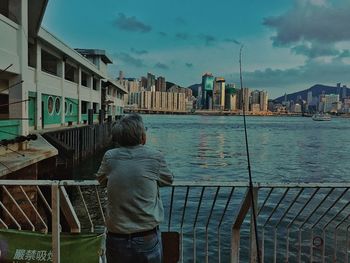View of buildings against cloudy sky