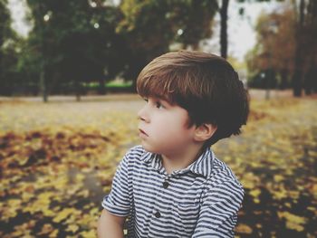 Cute boy looking away outdoors