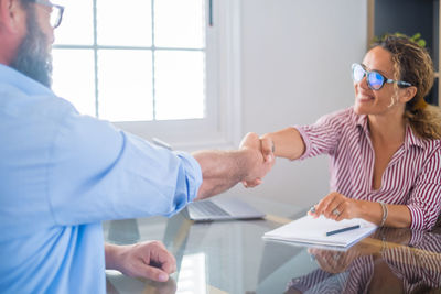 Female doctor examining patient in office