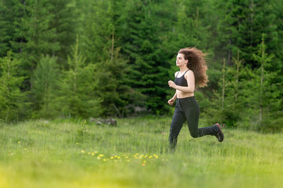 Woman running in field