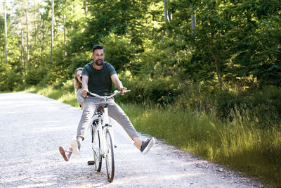 Man riding bicycle on road