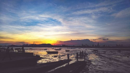 View of harbor at sunset