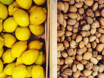 High angle view of lemons and almonds at market
