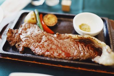 Close-up of meat served in plate on table