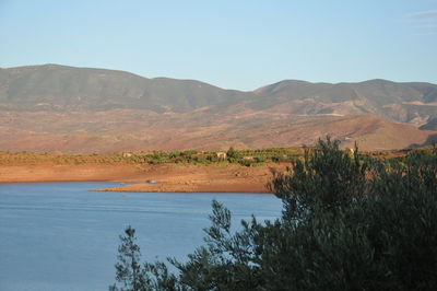 Scenic view of mountains against clear blue sky