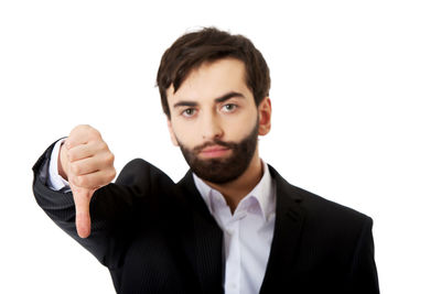 Portrait of young man against white background