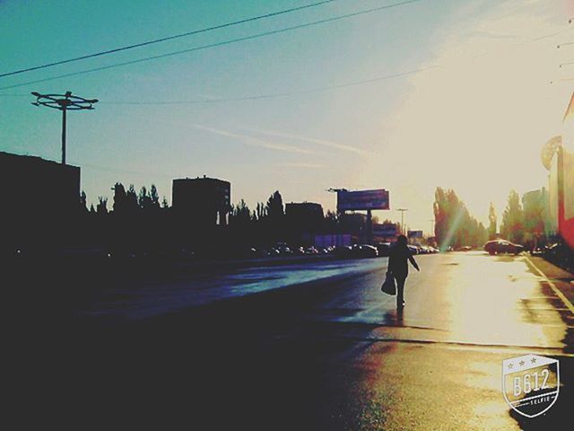 VIEW OF CITY STREET AT SUNSET