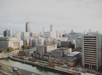 High angle view of buildings in city against sky