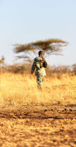 Full length of man on field against sky