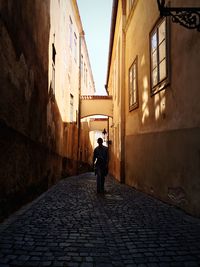 People walking on alley in city