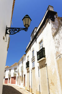 View of narrow pathway along built structures