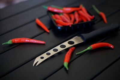 Close-up of red chili pepper on table