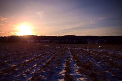 Scenic view of landscape at sunset