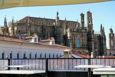 Panoramic view of buildings in city against sky