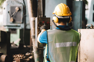 Rear view of man working