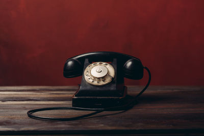 Close-up of telephone on table