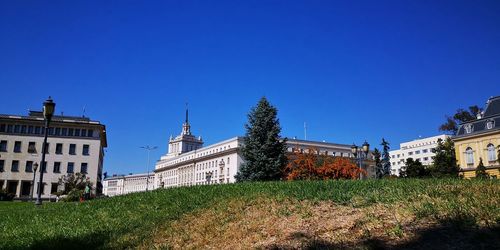 View of buildings against blue sky