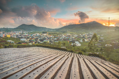 High angle view of cityscape against sky during sunset