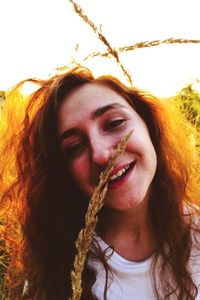 Portrait of beautiful woman against sky