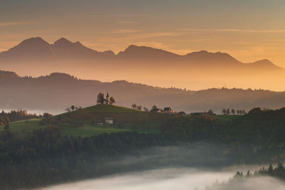 Scenic view of mountains against sky during sunset