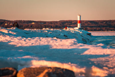 Sunset on a frozen petoskey michigan light house