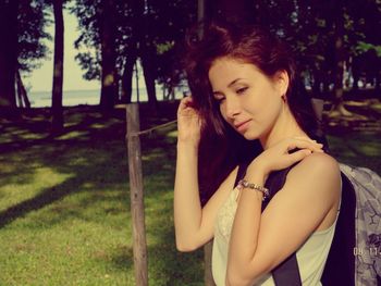 Portrait of young woman in grass