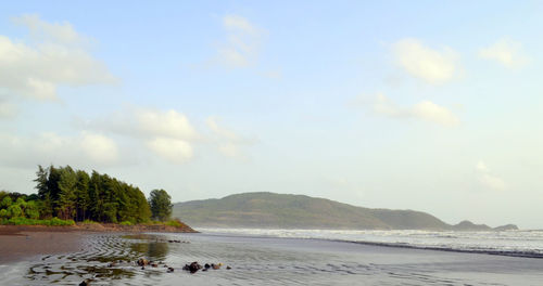 Scenic view of sea against cloudy sky