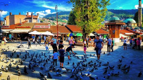 People at town square against sky