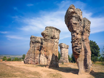 View of rock formation on land against sky