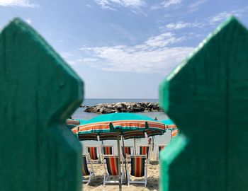 Building by sea against sky