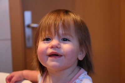 Portrait of cute baby at home