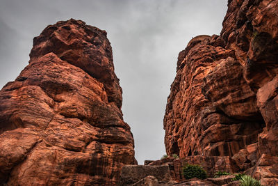 Low angle view of rock formation against sky