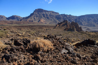 Scenic view of volcanic mountains against sky