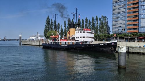Panoramic view of river by buildings against sky