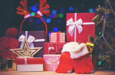 Close-up of presents against christmas tree