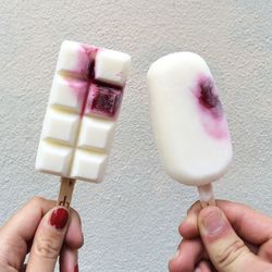 Close-up of hand holding ice cream