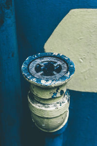 Close-up of bottle on the wall