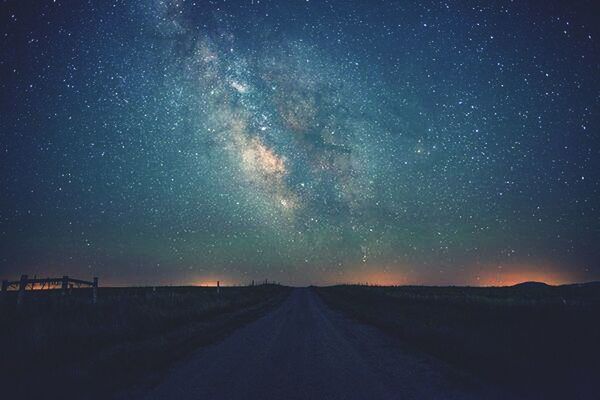 night, tranquil scene, tranquility, the way forward, star - space, scenics, sky, beauty in nature, road, landscape, star field, infinity, nature, astronomy, diminishing perspective, vanishing point, galaxy, dark, snow, country road