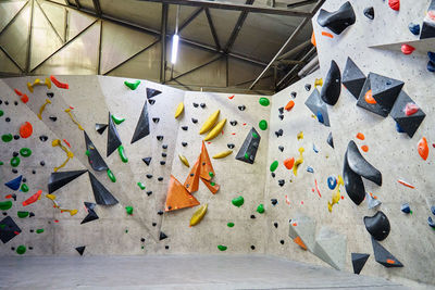 Bouldering gym with artificial colourful rock wall