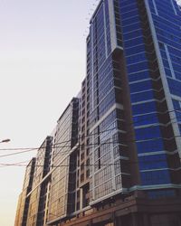 Low angle view of modern building against clear sky