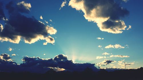 Scenic view of landscape against cloudy sky