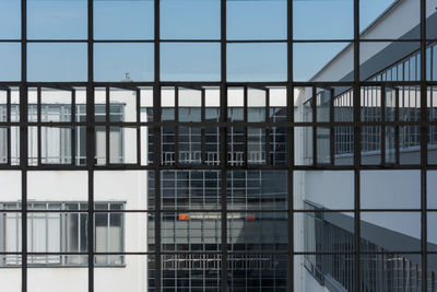 Full frame shot of modern glass building in city