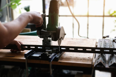 Close-up of man working on table