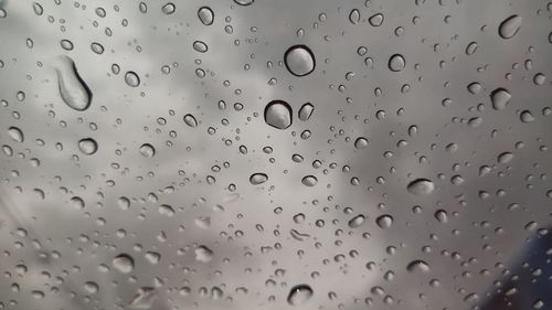 Full frame shot of wet glass window