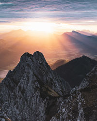 Scenic view of mountains against sky during sunset