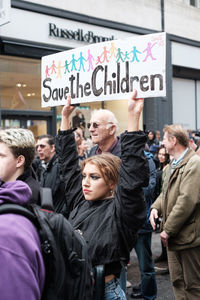 People standing on street in city