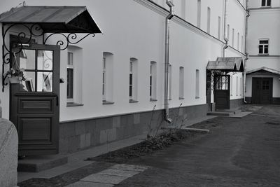 Empty alley amidst buildings in city