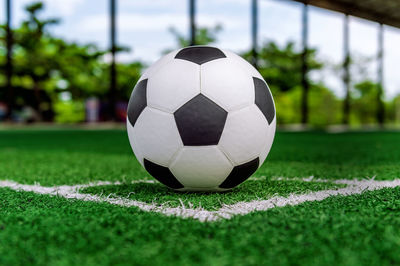 Close-up of soccer ball on field