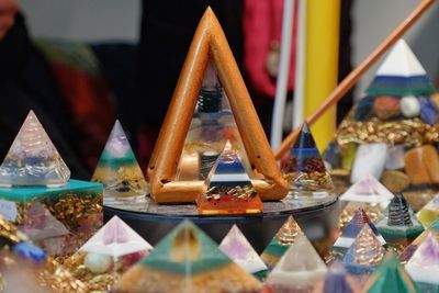 Close-up of multi colored pyramid shaped decoration for sale