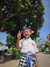 Portrait of a boy posing in a traditional balinese costume to celebrate indonesia's independence day 